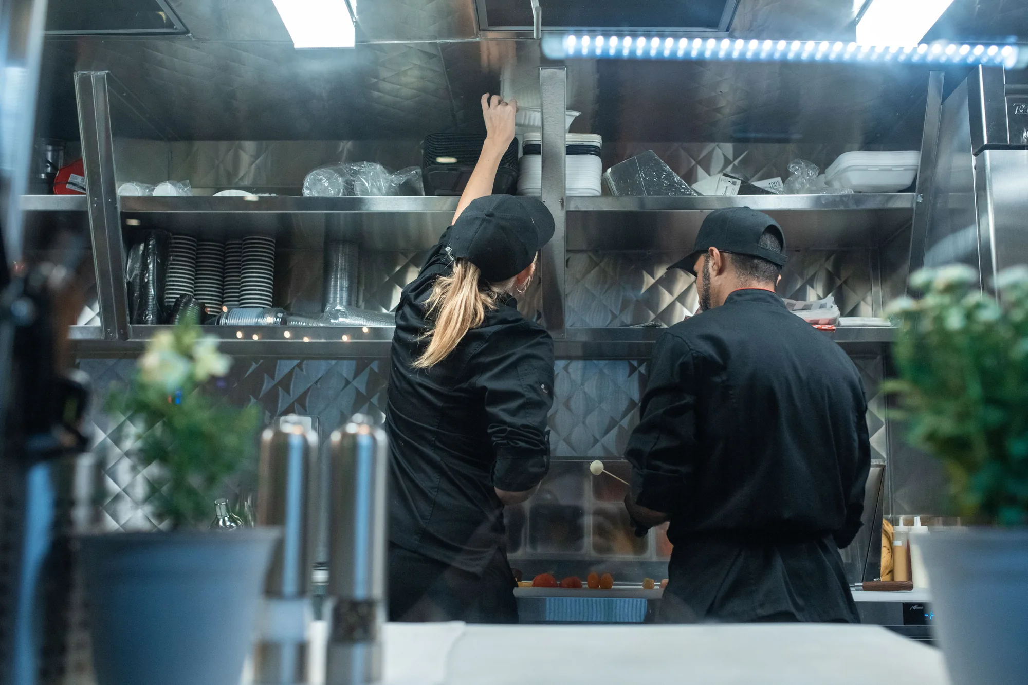 Chefs working the line in a professional restaurant kitchen